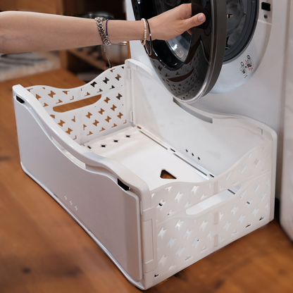 panier a linge pliable stocké directement contre machine a laver