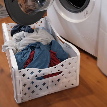 panier a linge pliable stocké directement contre machine a laver